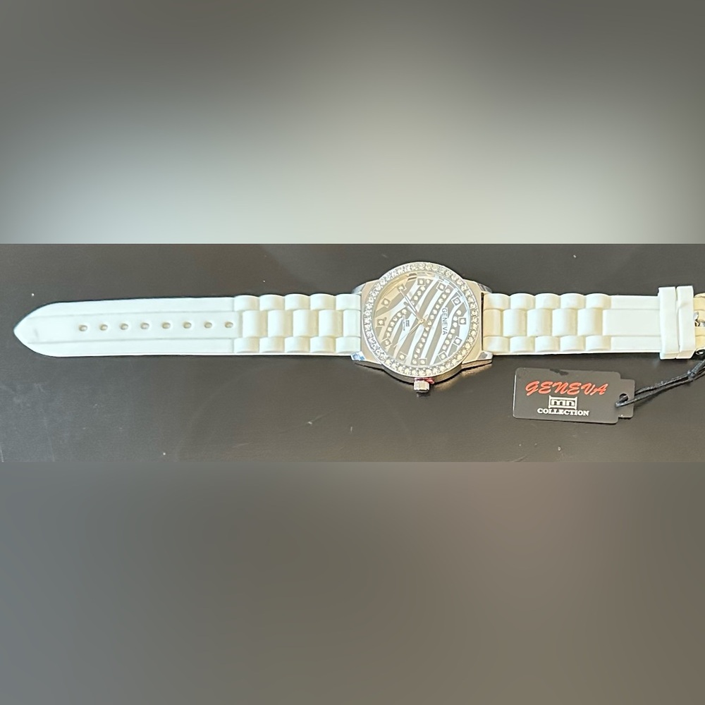 Geneva Silver tiger face Watch with rhinestone and silicone White Band. NWT.